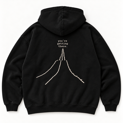 Schwarzer JURONOID Getting There Hoodie von hinten mit großem gesticktem Wegmotiv und „you're getting there.“